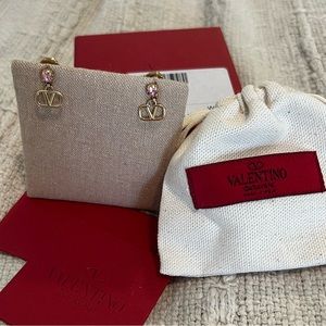 VLOGO signature earrings in metal and Swarvoski crystals.